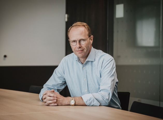 An image of Joan Jørgensen sitting at a desk